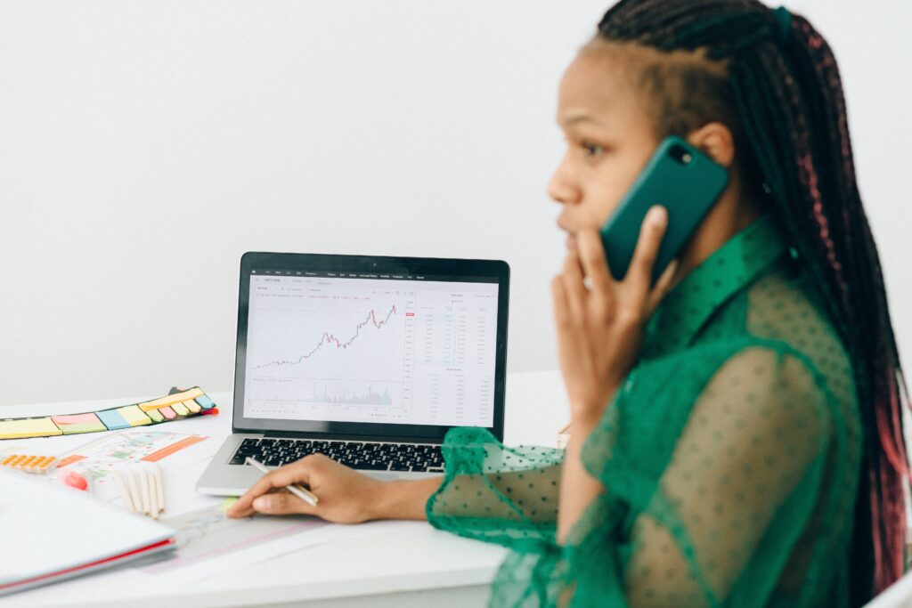 Woman reviewing her organization data while on a phone call