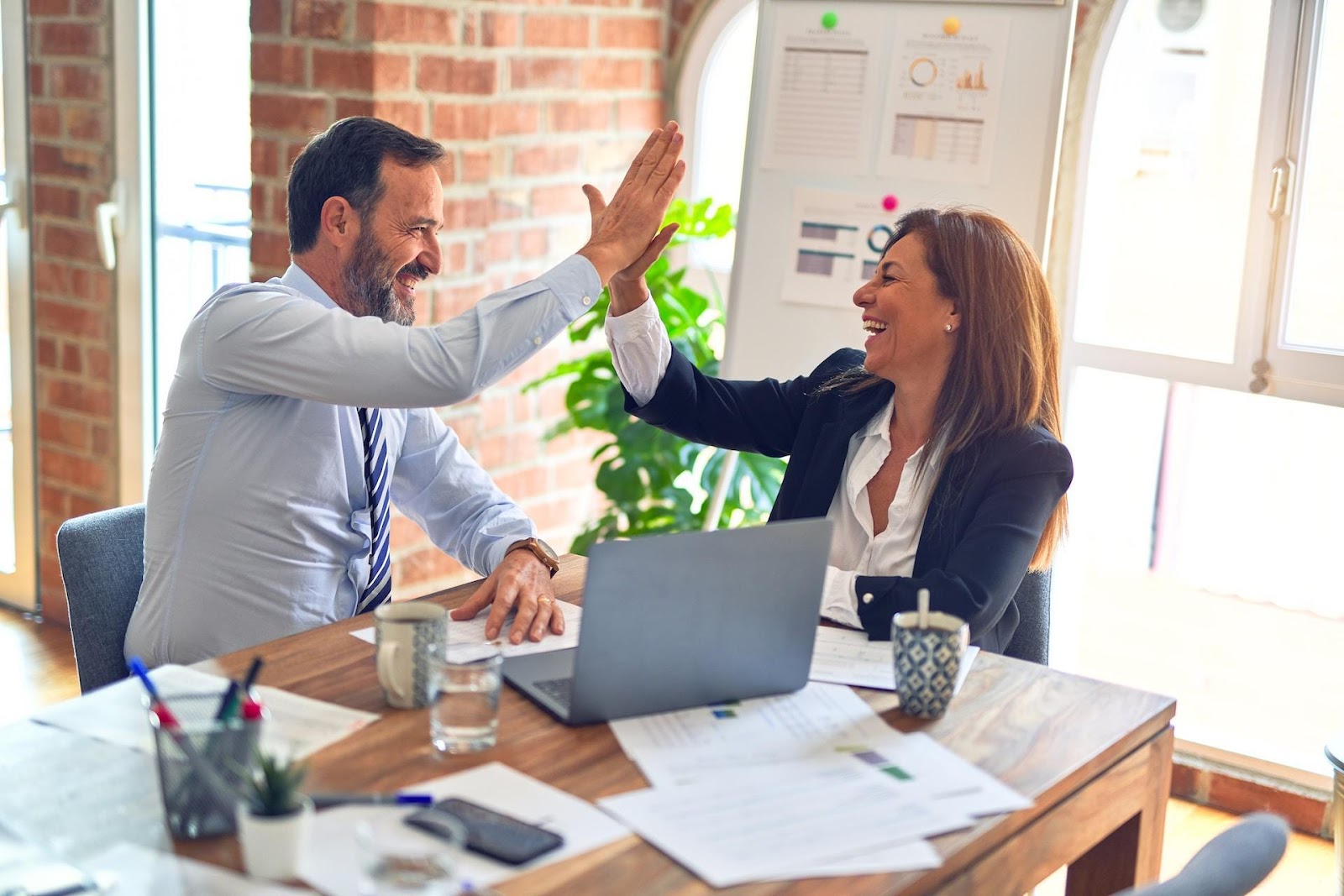 Business people high-fiving