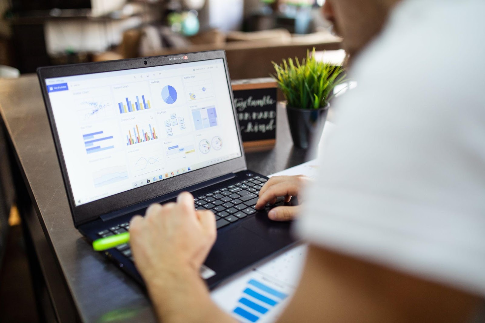 a person looking up data on a laptop