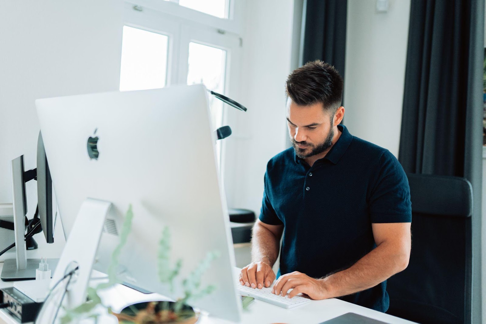 a man working on attribution reports on a laptop